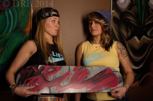 girls holding skateboard